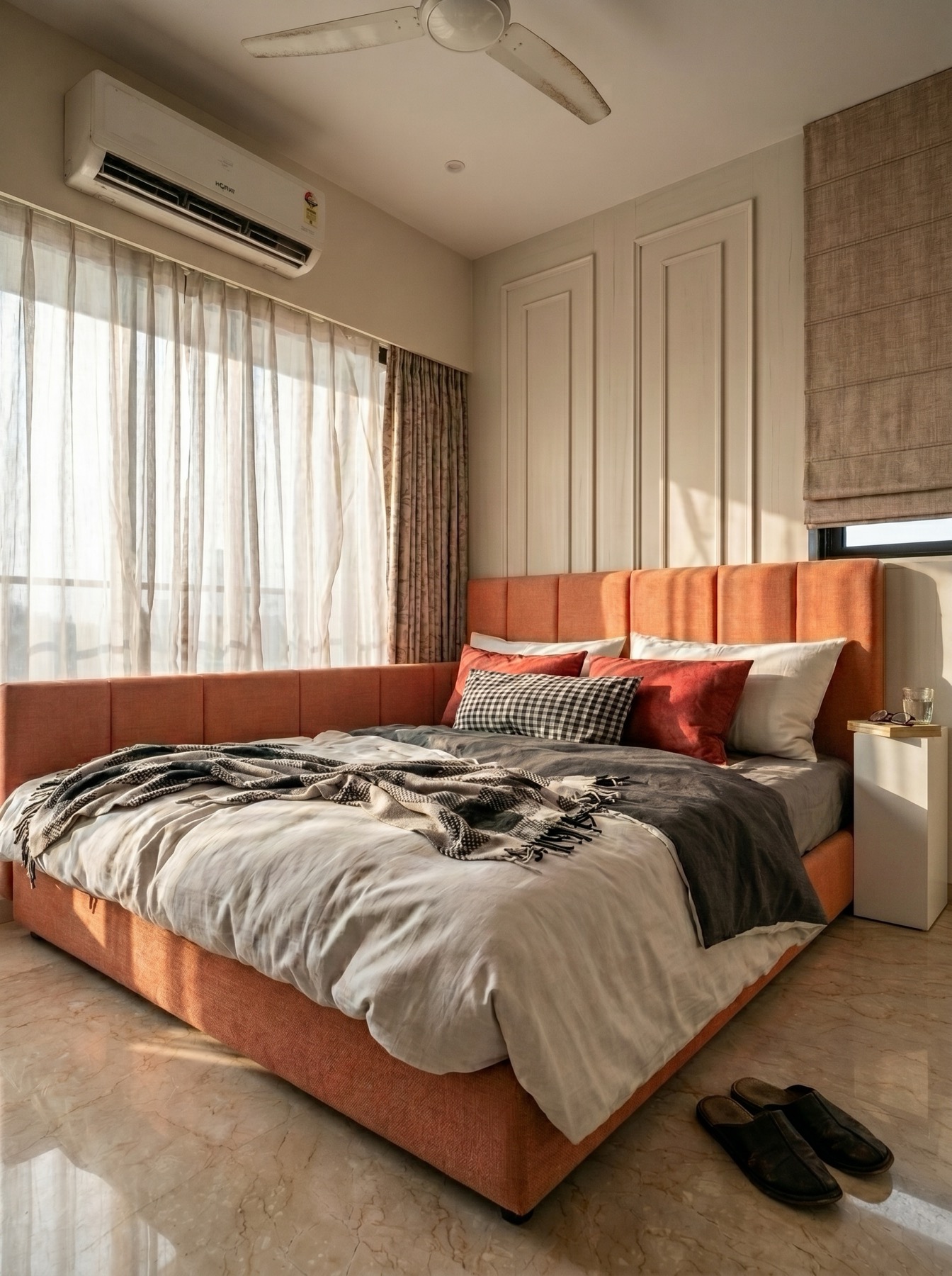 Master bedroom interior design Mumbai - upholstered bed frame with warm tone joinery by Ranzospace
