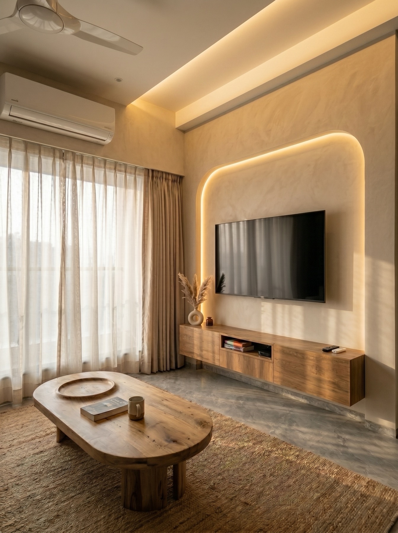 Living room TV nook by Ranzospace Mumbai - arched cove-lit alcove