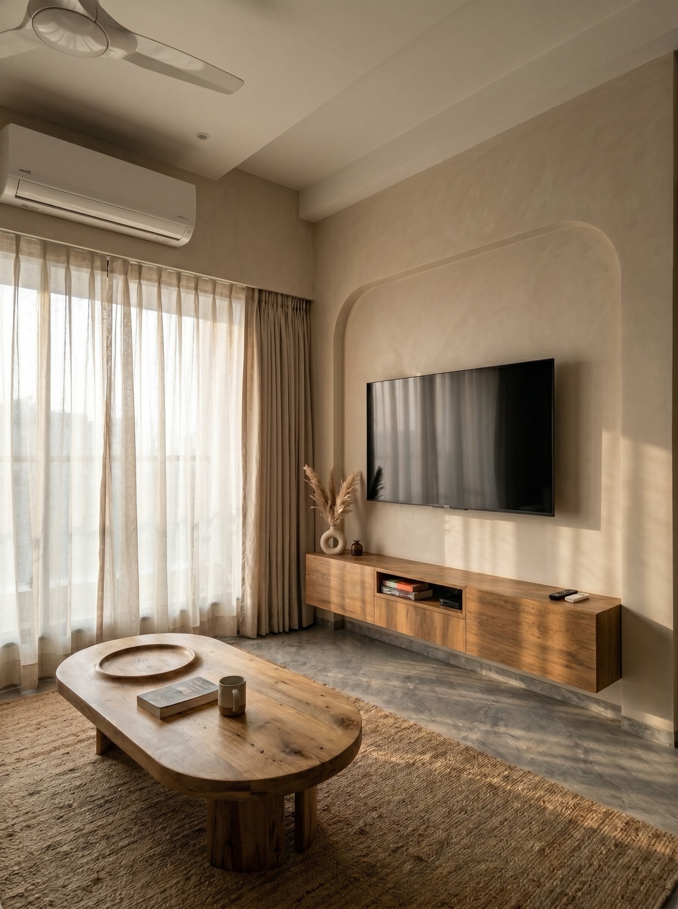 Living room interior design by Ranzospace Mumbai - floating wood console and sculptural coffee table